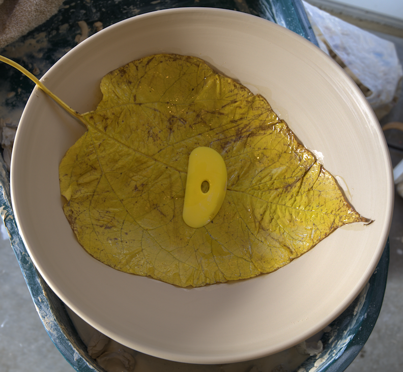 leaf pressed into bowl